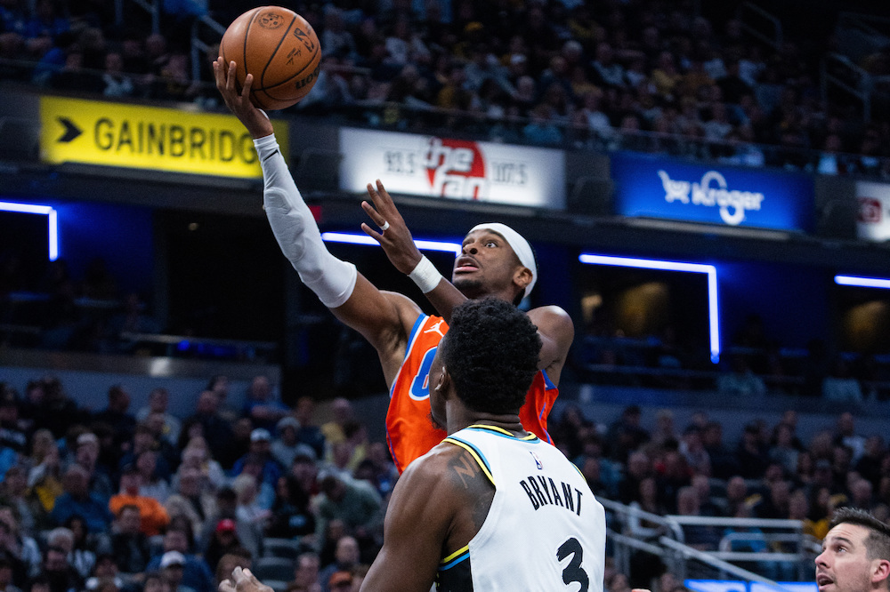 Oklahoma City Thunder guard Shai Gilgeous-Alexander drives for a layup against Indiana Pacers center Thomas Bryant defends during their NBA game at Gainbridge Fieldhouse on Thursday. (USA TODAY Sports)