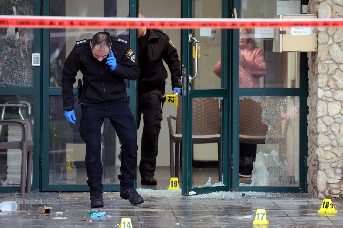 Israeli police check the scene of a stabbing attack in Herzliya, north of Tel Aviv, on Dec. 27, 2024. (AFP)