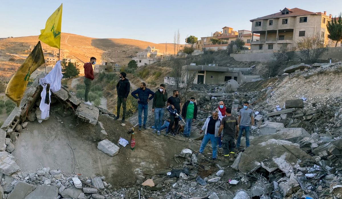 Rescuers search for survivors at the site of an Israeli airstrike that targeted the village of Shmestar in the Bekaa valley on November 23, 2024. (AFP file photo)
