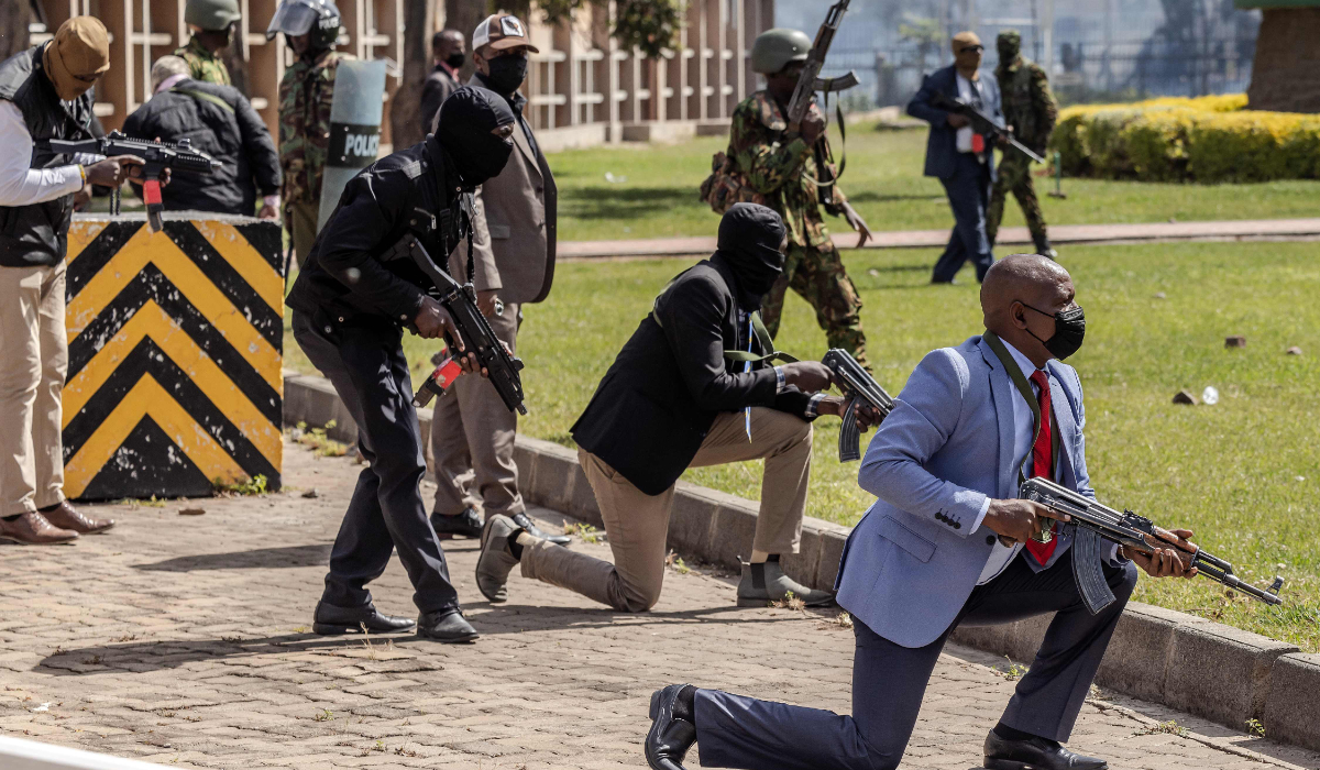 Kenyan Police officers and security personnel take positions to protect the Kenyan Parliament as protesters try to storm the building during a nationwide strike to protest against tax hikes and the Finance Bill 2024, in downtown Nairobi, on June 25, 2024. (AFP)