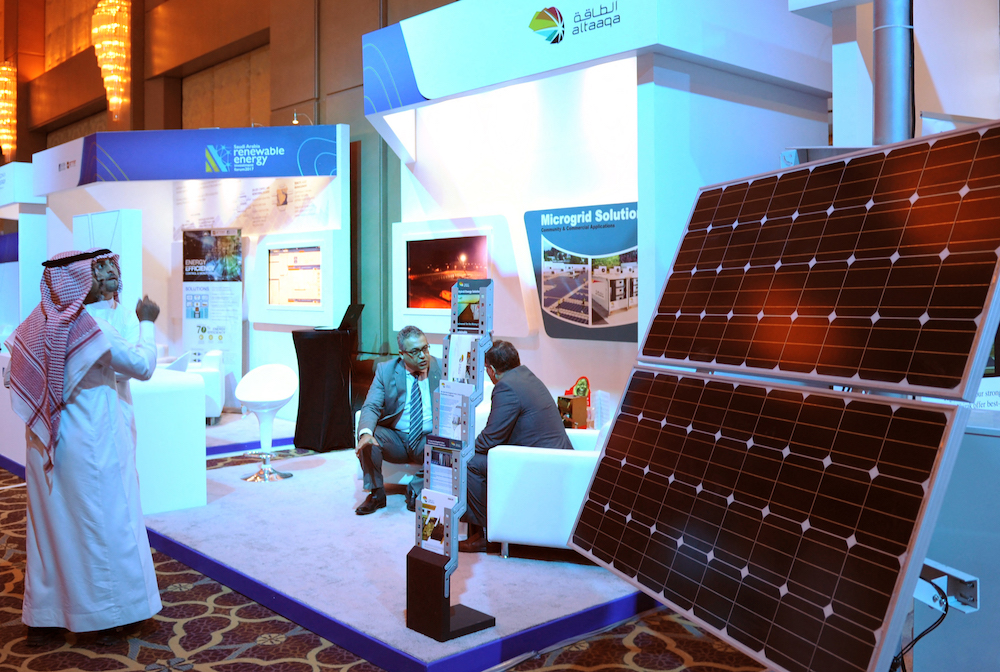 The Kingdom’s vast experience in energy production could be leveraged to accelerate its transition toward cleaner energy sources. Above, a renewable energy forum in Riyadh. (AFP file photo)