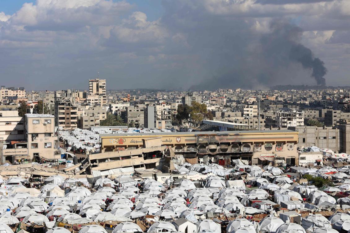 This picture taken from the central Gaza Strip shows smoke billowing in the background after an Israeli strike in the north of the Palestinian territory on Dec. 29, amid the ongoing war between Israel and the Palestinian Hamas movement. (AFP)