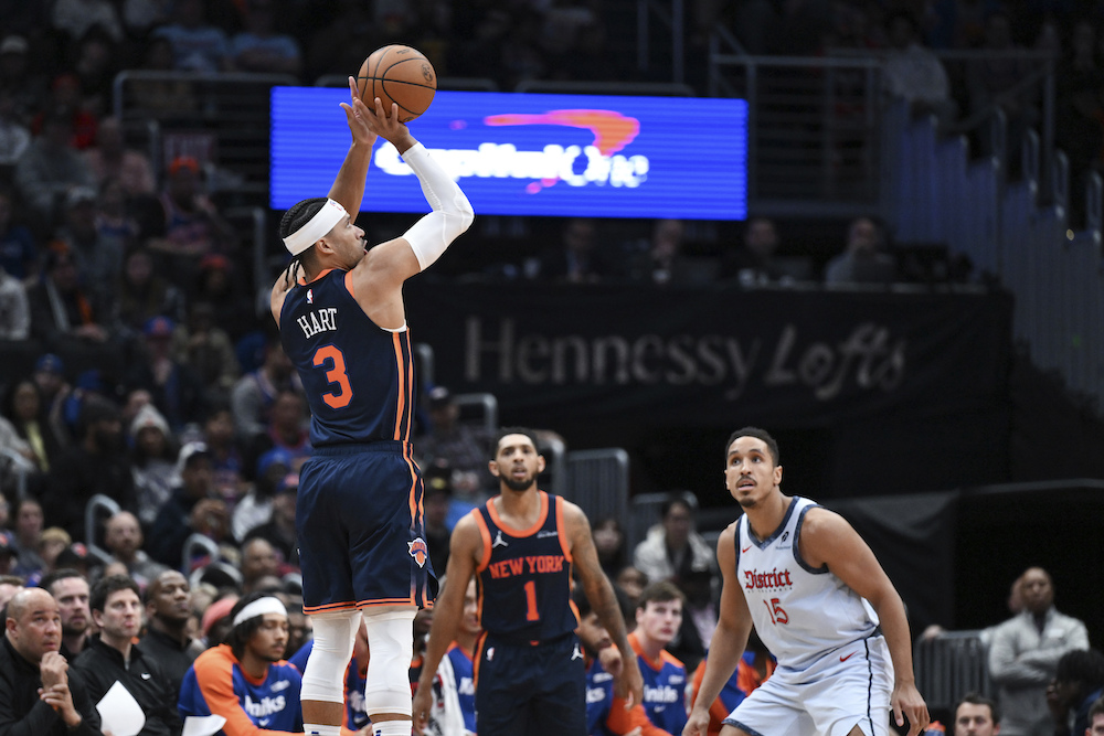 New York Knicks guard Josh Hart shoots a three-point basket during the first half of their NBA game against the Washington Wizards on Monday evening in Washington. (AP)