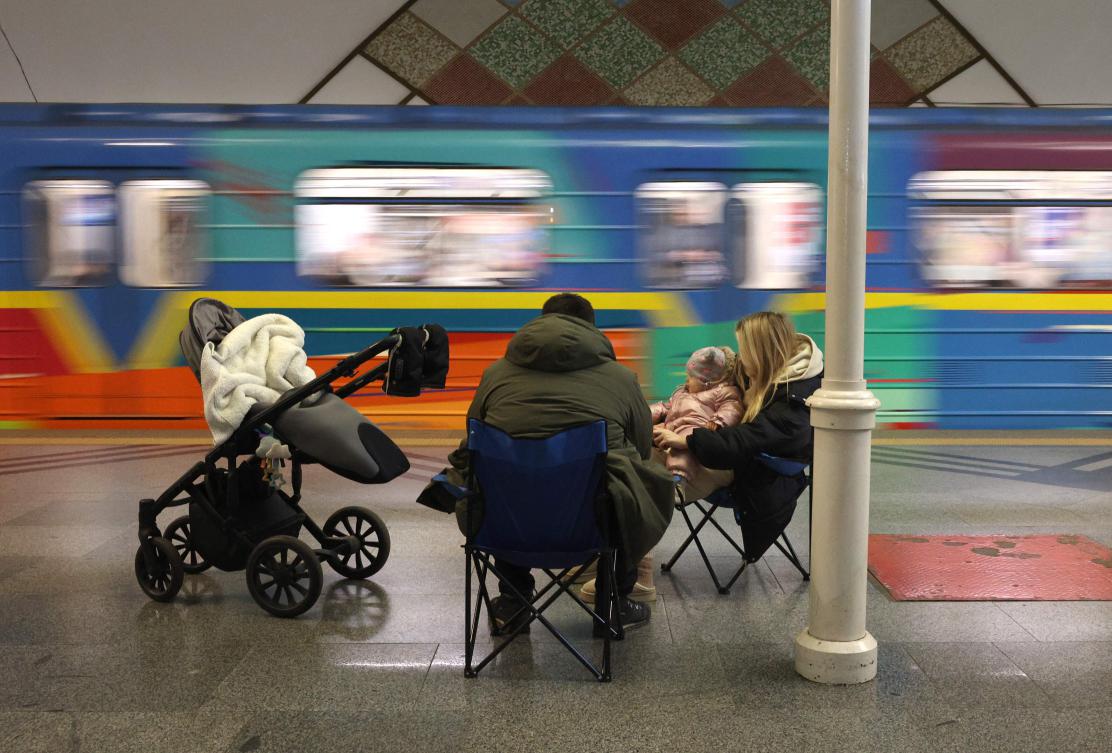Local residents take shelter in a metro station during an air strike alarm in Kyiv on Dec. 31, 2024. (AFP)