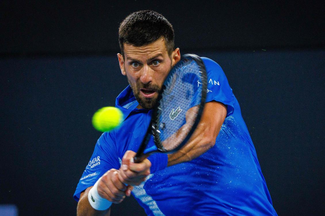 Novak Djokovic was all business against the young Australian wildcard Rinky Hijikata at the Brisbane International tennis tournament on Dec. 31, 2024. (AFP)