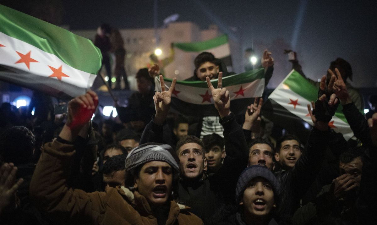 People celebrate during New Year's Eve festivities at Umayyad Square in Damascus, Syria, Tuesday, Dec. 31, 2024. (AP)