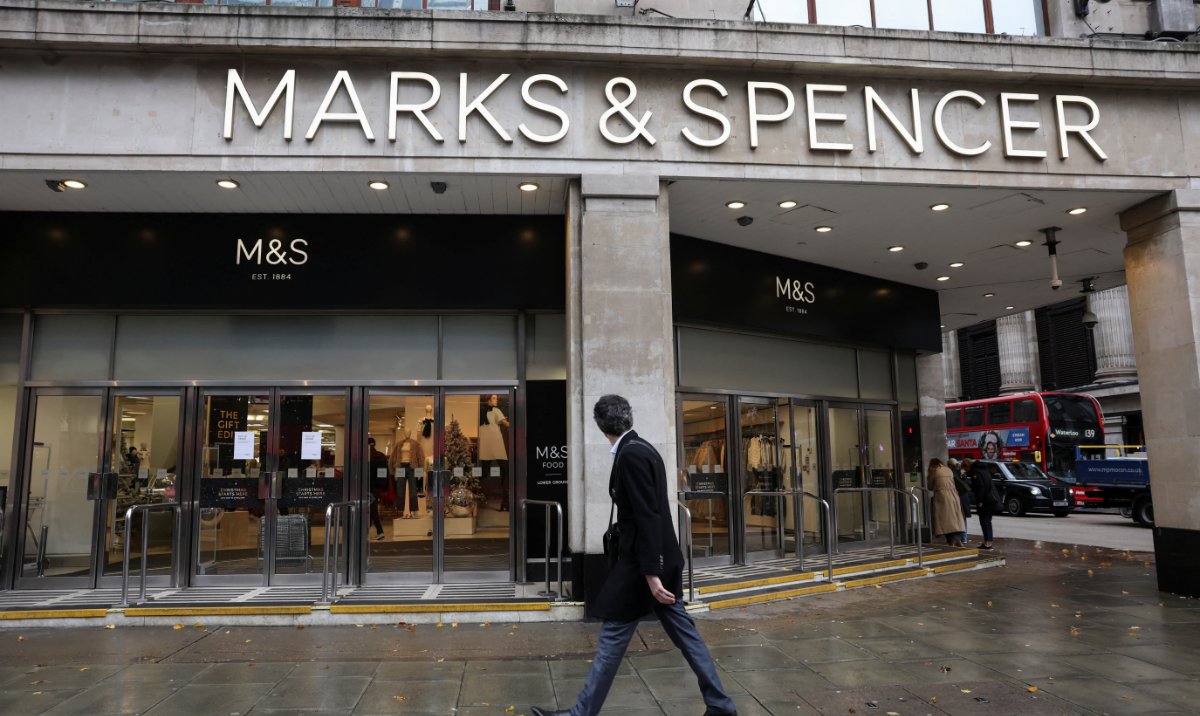 A passerby walks past a Marks & Spencer store near Marble Arch on Oxford Street, in London, Britain, December 5, 2024. (Reuters)