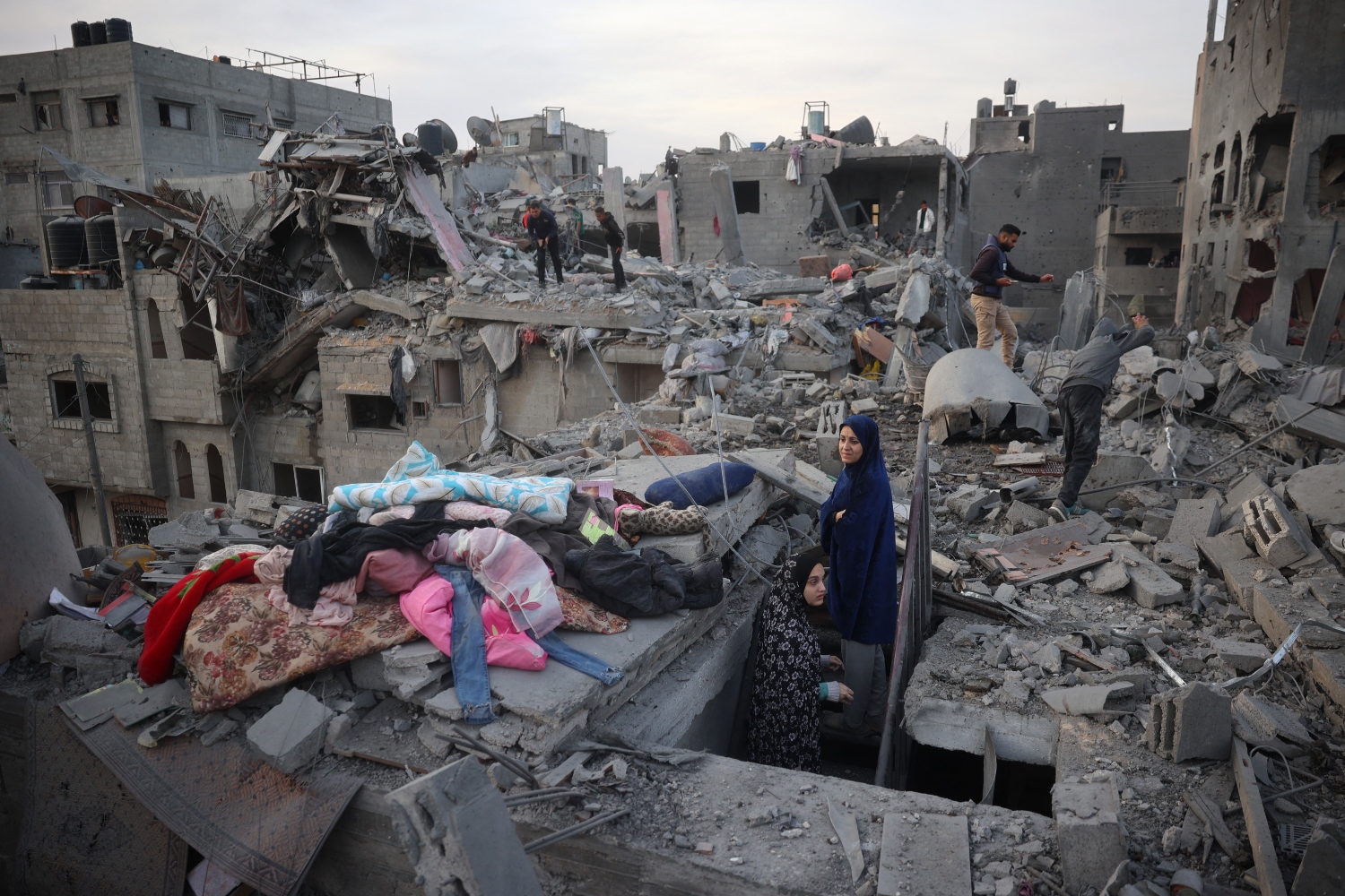 Palestinians inspect the damage after an Israeli strike on the Nuseirat camp, central Gaza Strip. December 07, 2024 (File/AFP)