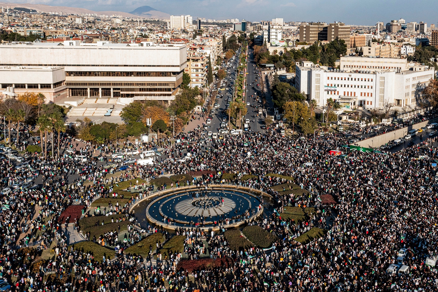 The celebrations across Syrian cities were illustrative of the elation of being Assad-free for the first time in 53 years (AFP)