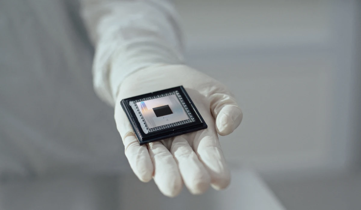 A person shows Google Quantum AI's "Willow" chip, in this undated handout photo on December 6, 2024. (REUTERS)
