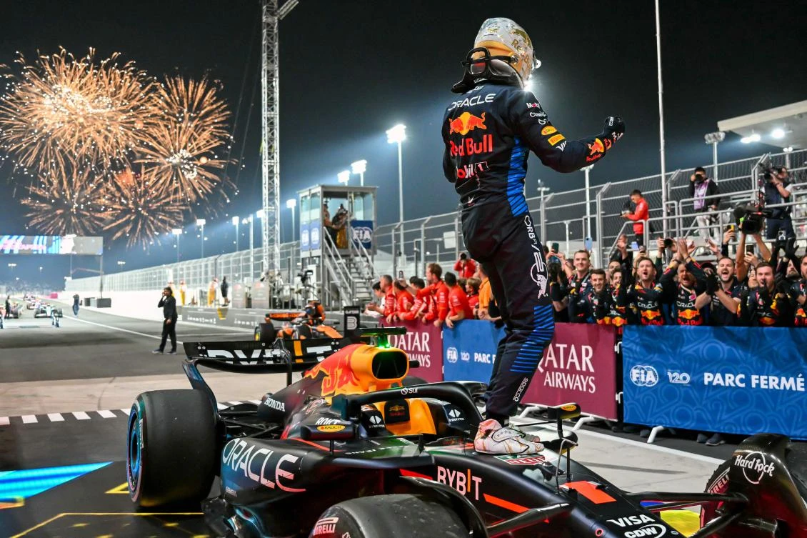 Red Bull Racing’s Dutch driver Max Verstappen celebrates as he gets out of his car at parc ferme after winning the Qatari Formula One Grand Prix at the Lusail International Circuit in Lusail, Doha, on Dec. 1, 2024. (AFP)