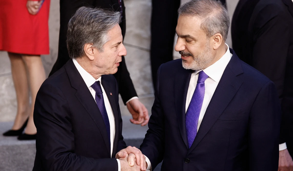US Secretary of State Antony Blinken (L) shakes hands with Turkish Foreign Minister Hakan Fidan (R) after an official photo during the North Atlantic Council (NAC) Ministers of Foreign Affairs meeting at the NATO headquarters in Brussels on April 3, 2024. (AFP)