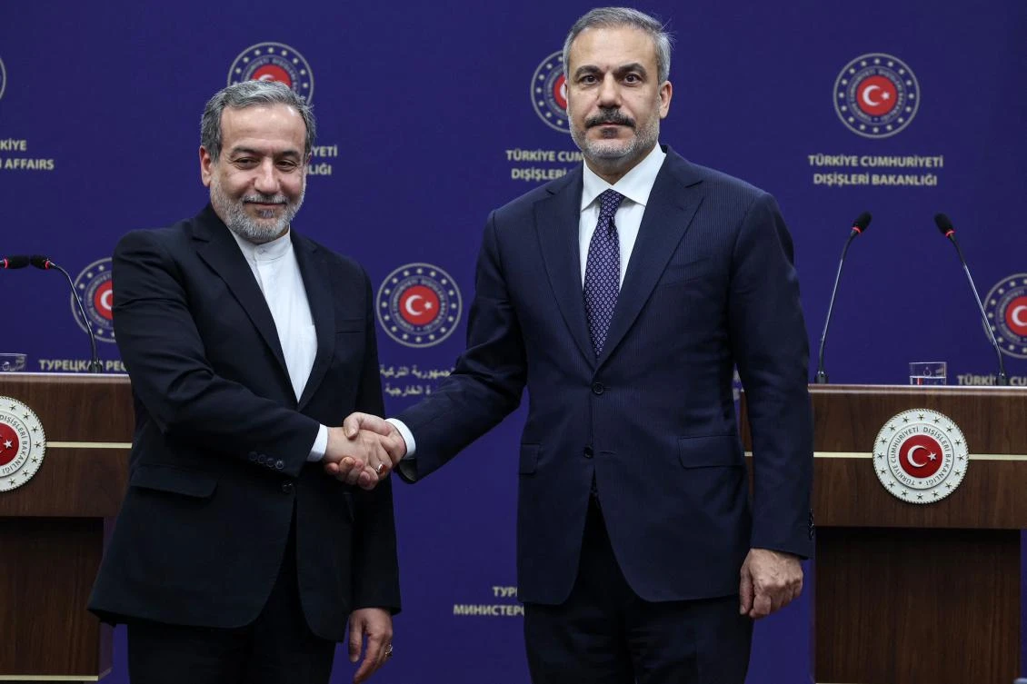 Turkish Foreign Minister Hakan Fidan (R) shakes hands with Iranian Foreign Minister Abbas Araghchi (L) at the end of a joint press conference after their meeting in Ankara on December 2, 2024. (AFP)