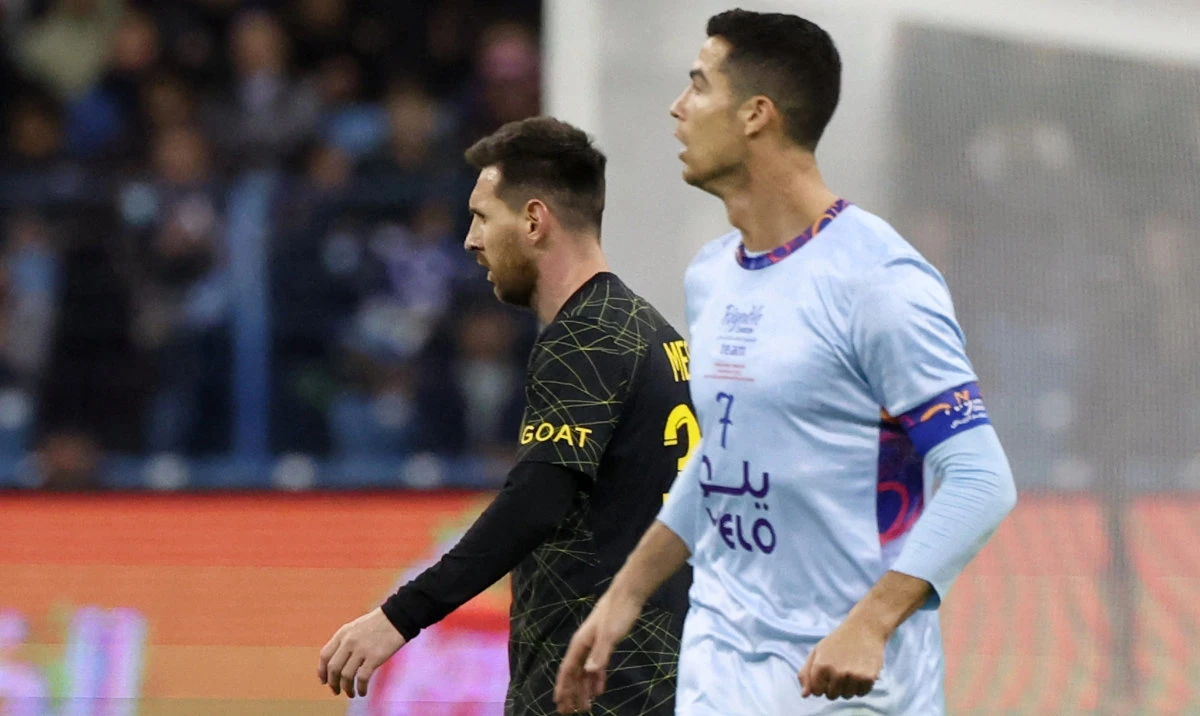 Paris Saint-Germain’s Argentine forward Lionel Messi (L) and Riyadh All-Star’s Portuguese forward Cristiano Ronaldo during the Riyadh Season Cup football match between the Riyadh All-Stars and Paris Saint-Germain at the King Fahd Stadium in Riyadh on Jan. 19, 2023. (AFP/File)