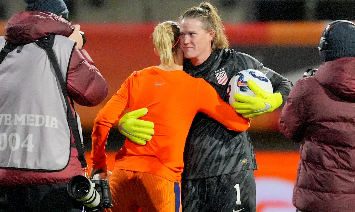 Netherlands' Jackie Groenen and US goalkeeper Alyssa Naeher share a hug at the end of the international friendly women's soccer match between the Netherlands and the US at the ADO Den Haag Stadium in The Hague, Netherlands, Tuesday. (AP)