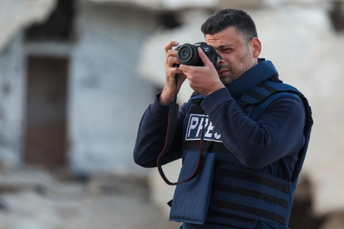 Syrian photojournalist Anas Alkharboutli at work in the northern Syrian village of Ariha on November 10. The award-winning photographer, who worked for German press agency DPA, was killed in an air strike near the Syrian city of Hama on December 3. (AFP)
