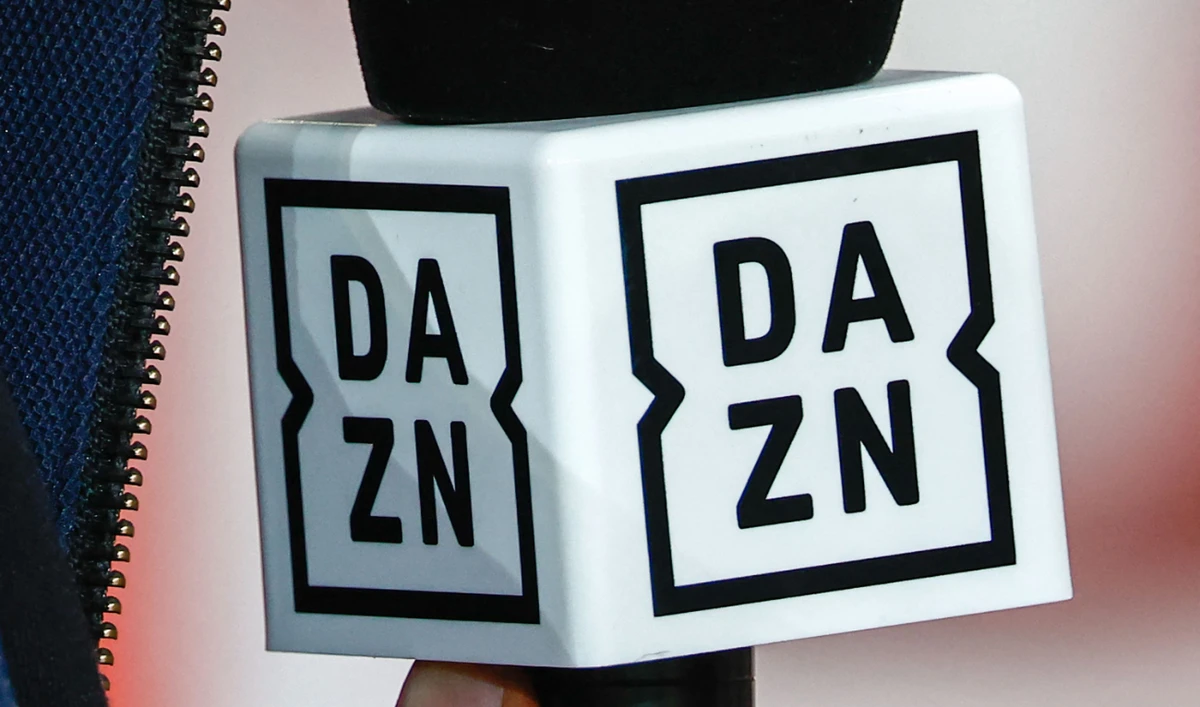 A journalist holds a microphone of DAZN during the French L1 match between Lille LOSC and Paris Saint-Germain on Sept. 1, 2024. Worldwide TV rights for the 2025 FIFA Club World Cup have been awarded DAZN for a sum of around €1 billion, AFP learned on Dec. 4, 2024. (File/AFP)