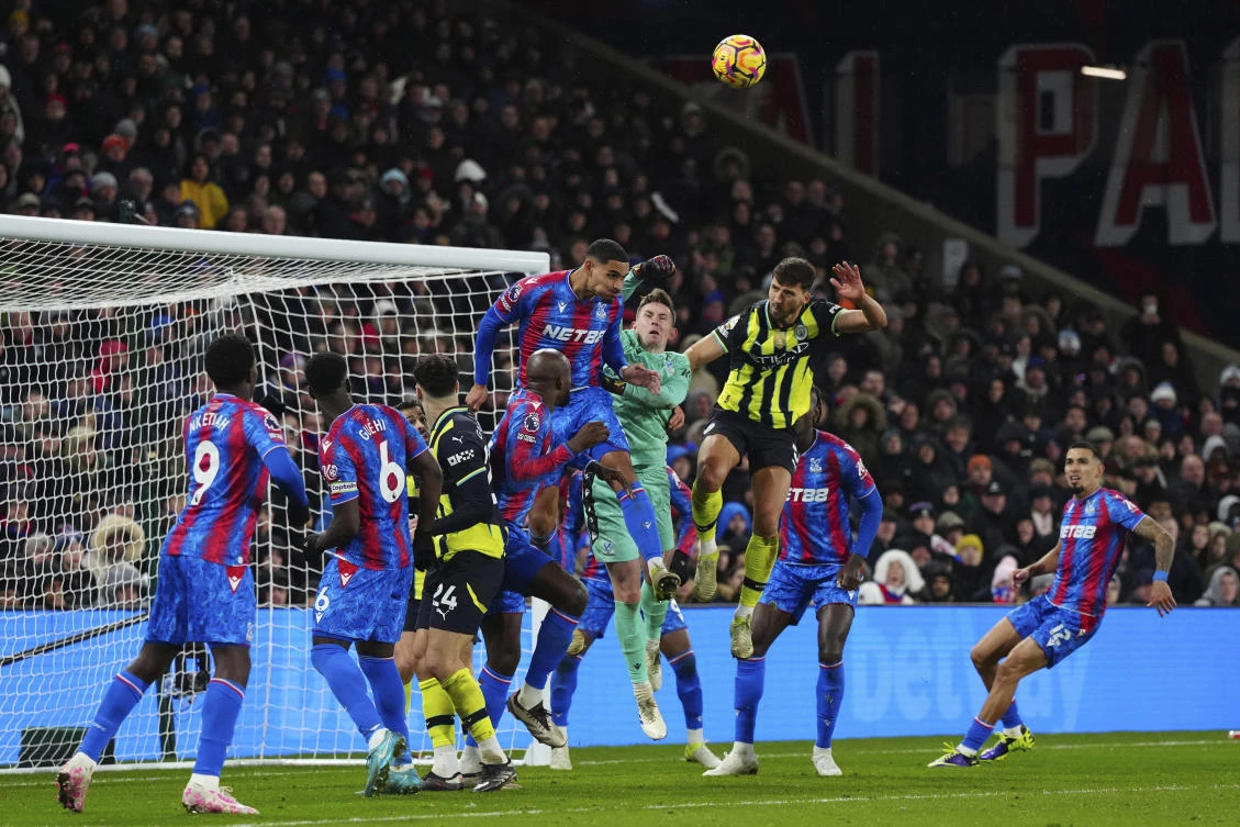 Manchester City’s John Stones, top right, Crystal Palace’s Maxence Lacroix and goalkeeper Dean Henderson battle for the ball during their English Premier League match at Selhurst Park in London, Dec. 7, 2024. (AP)