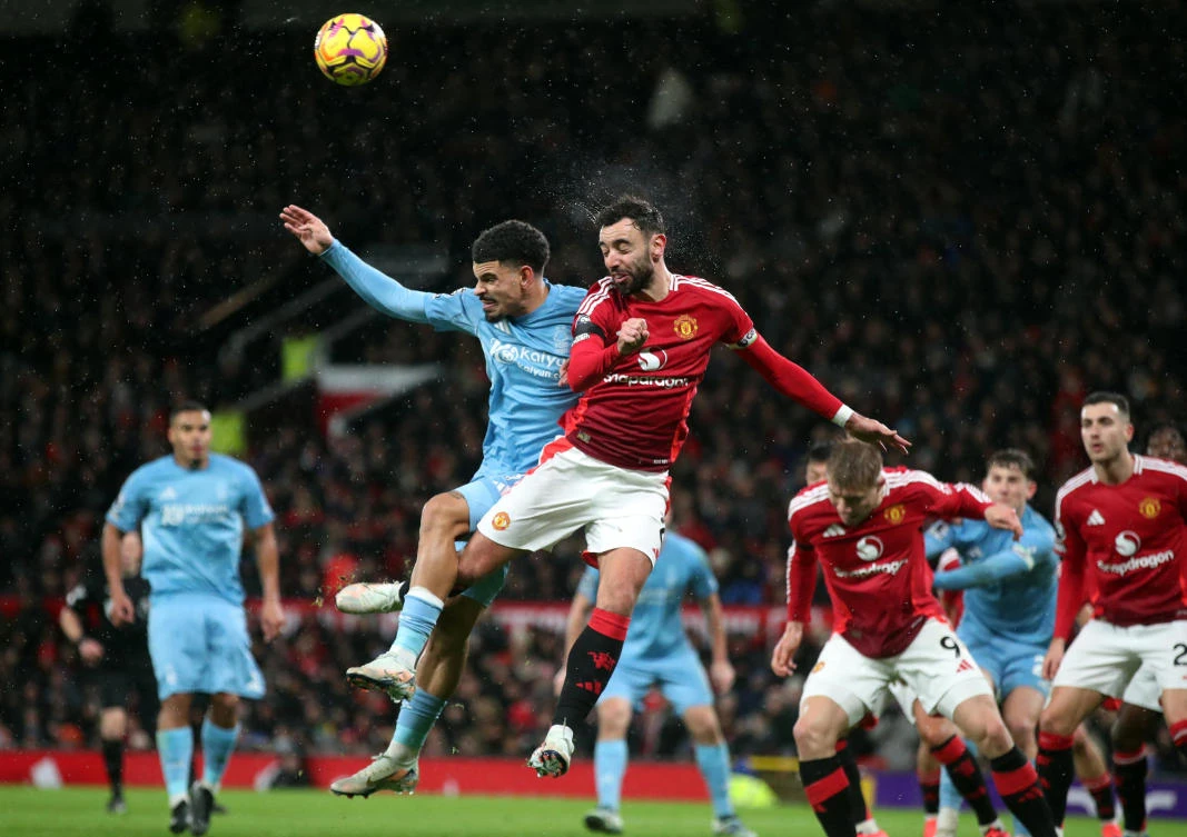 Nottingham Forest’s Morgan Gibbs-White in action with Manchester United’s Bruno Fernandes during their Premier League match at Old Trafford, Manchester, Dec. 7, 2024. (Reuters)