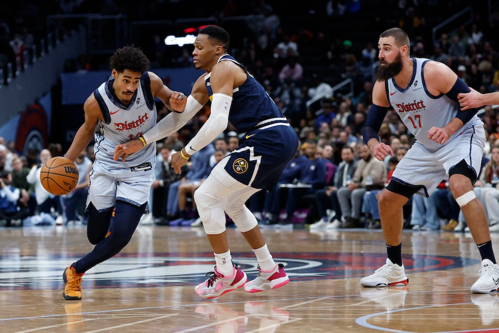 Washington Wizards guard Jordan Poole drives to the basket as Denver Nuggets guard Russell Westbrook defends in the fourth quarter of an NBA game at Capital One Arena Saturday. (USA TODAY Sports)