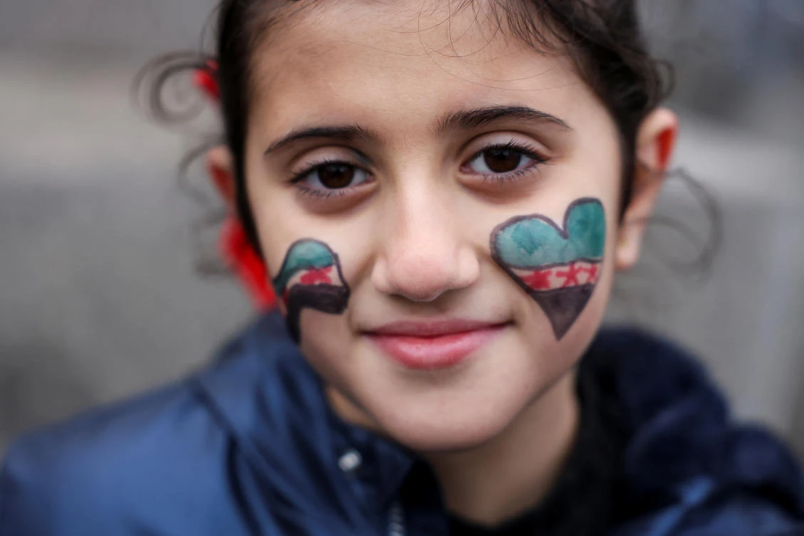 Lareen, 8, looks on as people gather in Trafalgar Square, after Syrian militants announced that they have ousted Syria's Bashar al-Assad, in London, Britain December 8, 2024. (Reuters)