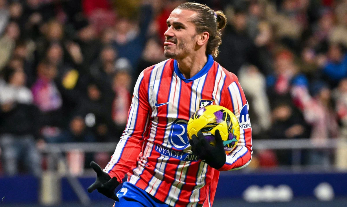 Atletico Madrid's French forward #07 Antoine Griezmann celebrates after scoring their second goal during the Spanish league football match between Club Atletico de Madrid and Sevilla FC at the Metropolitano stadium in Madrid on December 8, 2024. (AFP)
