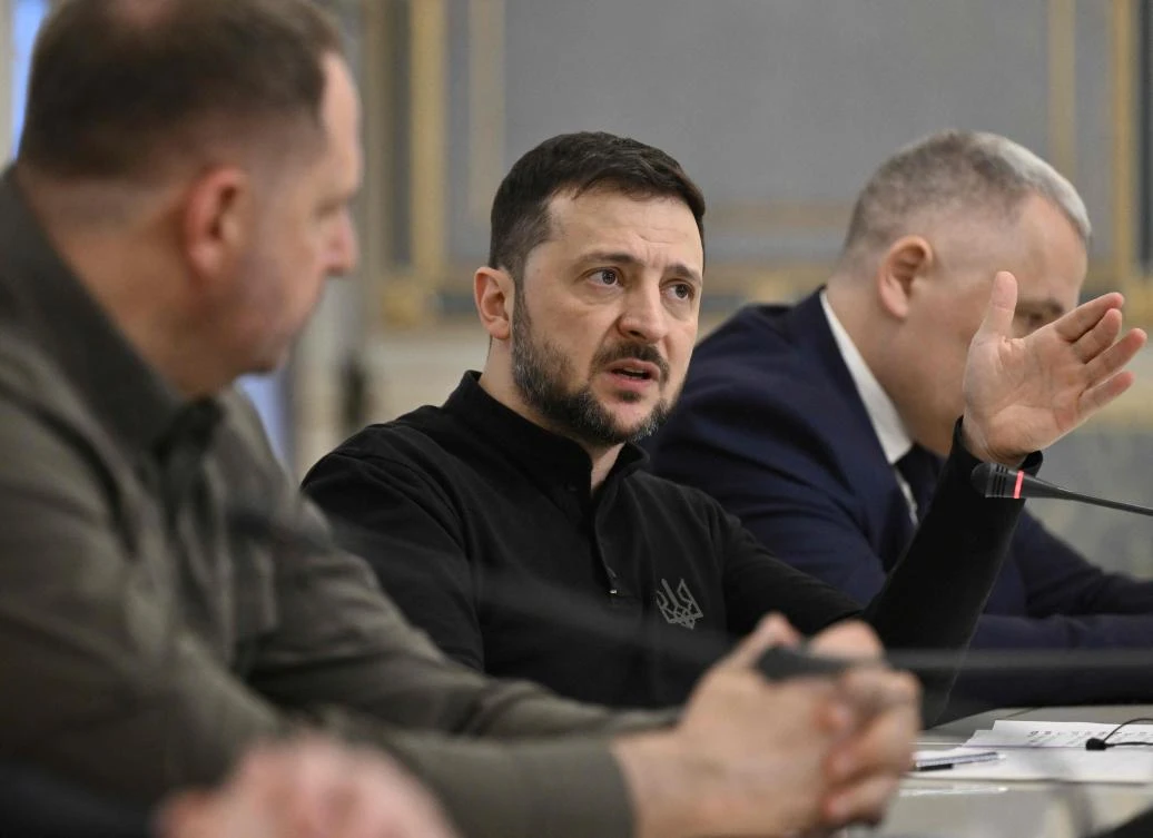 Ukrainian President Volodymyr Zelensky speaks with Leader of Germany’s Christian Democratic Union (CDU) during their meeting in Kyiv on December 9, 2024, amid the Russian invasion of Ukraine. (AFP)