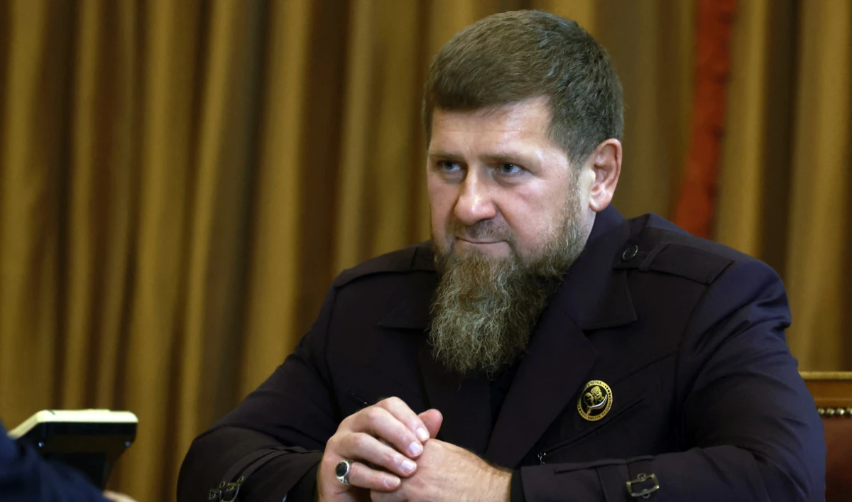 In this pool photograph distributed by Russian state owned Sputnik agency the head of the Chechen Republic Ramzan Kadyrov looks on during a meeting with Russia's President Vladimir Putin in Grozny, on August 20, 2024. (AFP/File)
