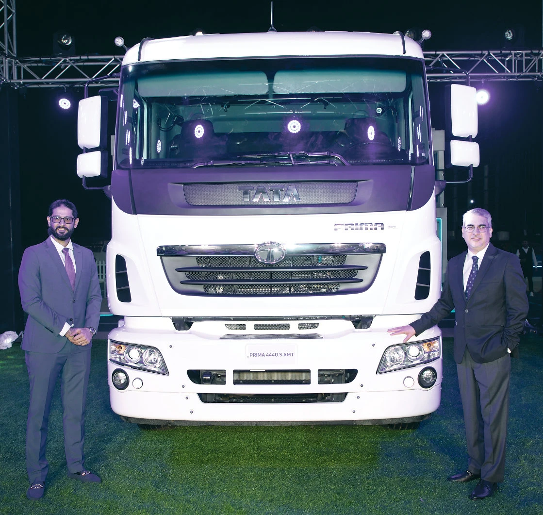 Azeem Khan, managing director, Mohamed Yousuf Naghi Motors Co., and Anurag Mehrotra, head, international business, Tata Motors, unveil the Tata Prima 4440.S AMT in Dammam.