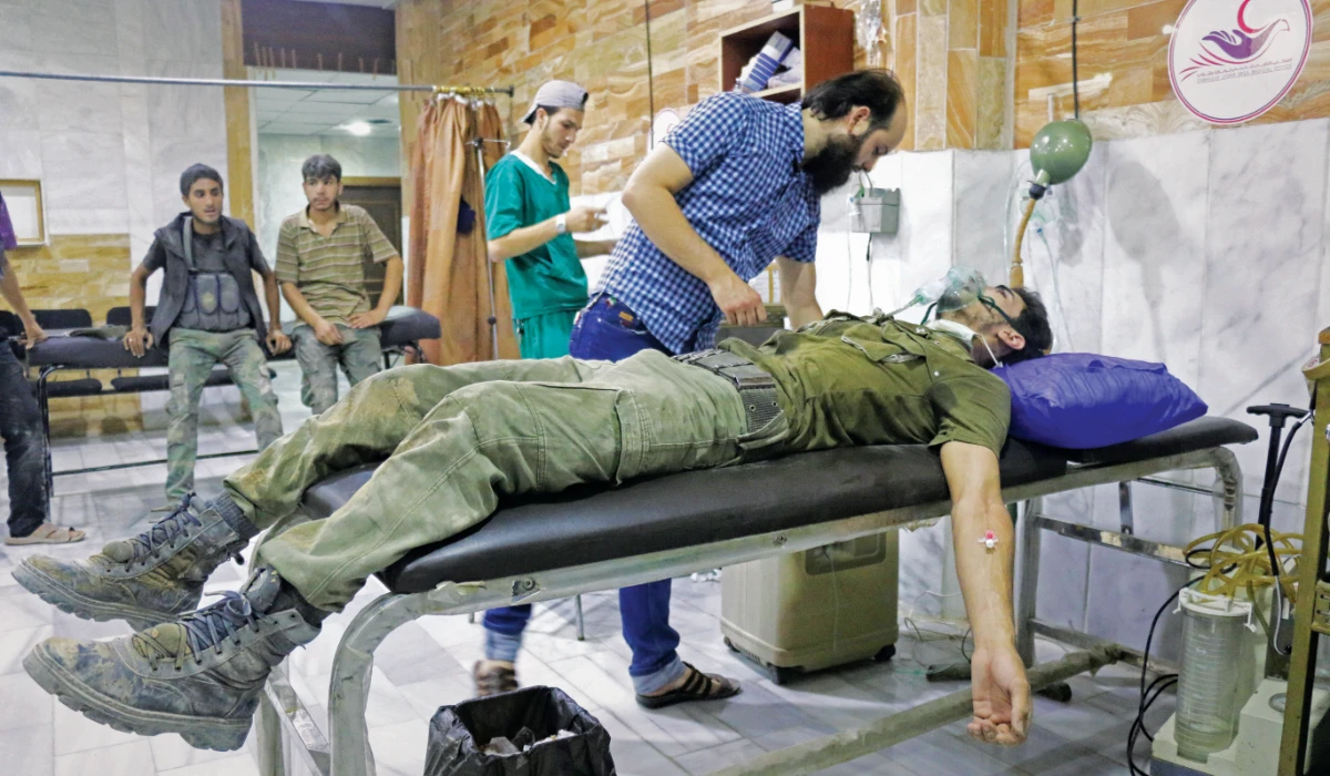 A member of opposition forces receives medical treatment after Assad regime's alleged chemical gas attack over oppositions' frontline, where is included in deconfliction zone in East Ghouta of Damascus, Syria on July 20, 2017. (Getty Images)