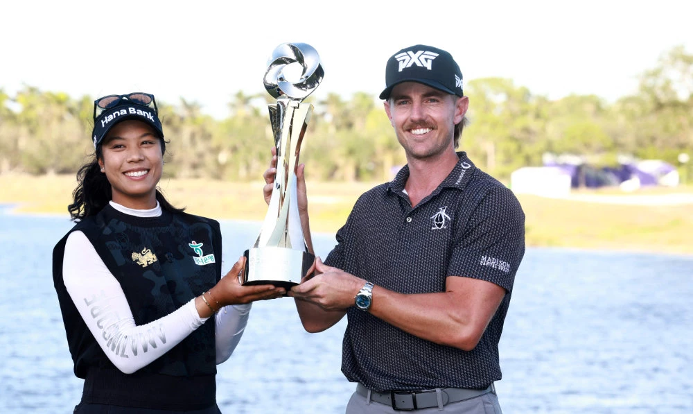 Patty Tavatanakit of Thailand and Jake Knapp of the US pose with the champion trophy after winning the Grant Thornton Invitational 2024 at Tiburon Golf Club on Dec. 15, 2024 in Naples, Florida. (AFP)