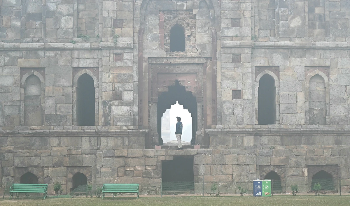 A man visits the Lodhi gardens on a cold smoggy morning in New Delhi on November 18, 2024. (AFP/File)