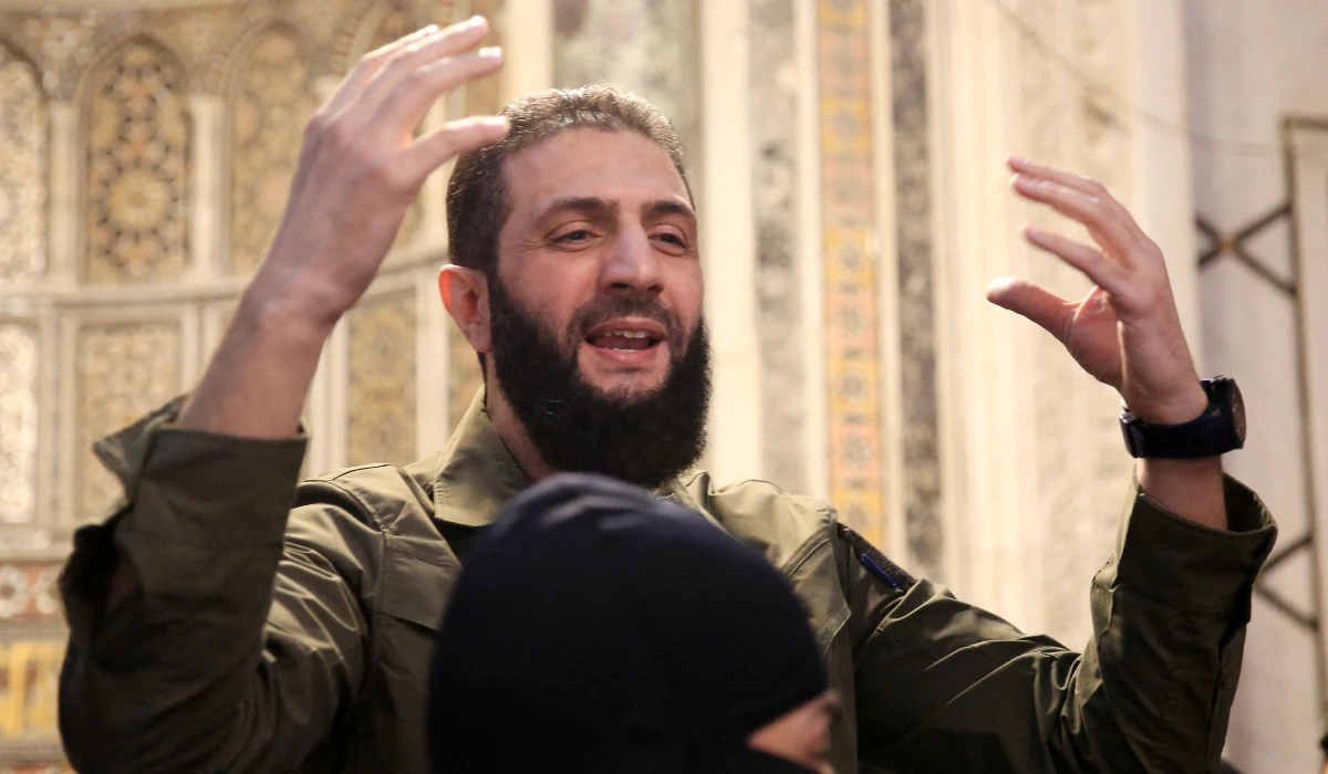 The leader of Syria's Islamist Hayat Tahrir al-Sham (HTS) group that headed a lightning rebel offensive snatching Damascus from government control, Abu Mohammed al-Jolani, address a crowd at the capital's landmark Umayyad Mosque on December 8, 2024. (AFP)