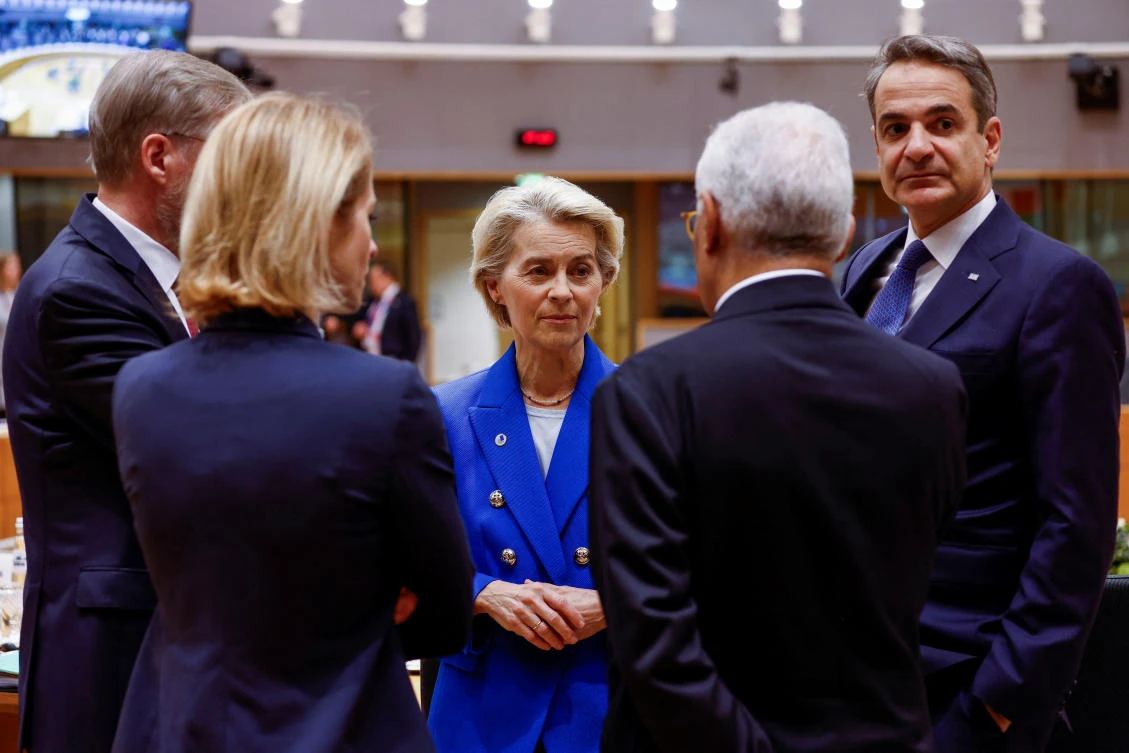 European Commission President Ursula von der Leyen stands with Greece's Prime Minister Kyriakos Mitsotakis and other officials on the day of a European Union leaders summit in Brussels, Belgium, December 19, 2024. (Reuters)