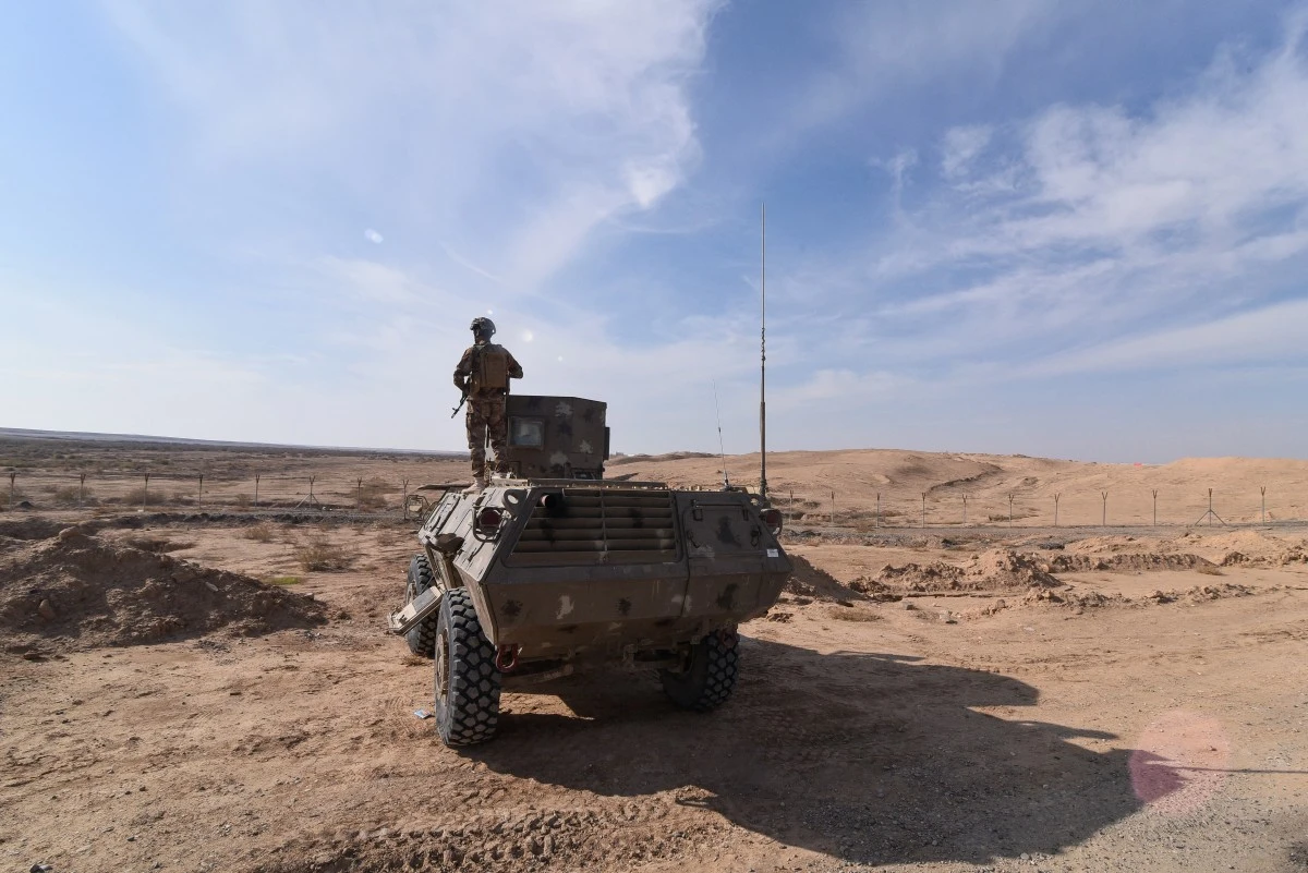 members of a joint Hashed and Iraqi army force standing guard at the Iraqi-Syrian border on December 5, 2024. (File/AFP)