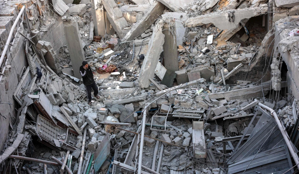 A man inspects the damage following an Israeli strike on a home belonging to the al-Zaytouniyah family, in the al-Daraj neighbourhood in Gaza City, in the central Gaza Strip on December 19, 2024, amid the continuing war between Israel and the Palestinian militant Hamas group. (AFP)