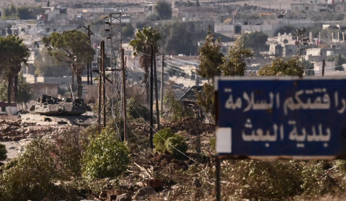 An Israeli army tank takes position in the Syrian town of Madinat al-Baath, in the UN-patrolled buffer zone in the Israeli-annexed Golan Heights on December 20, 2024. (AFP)