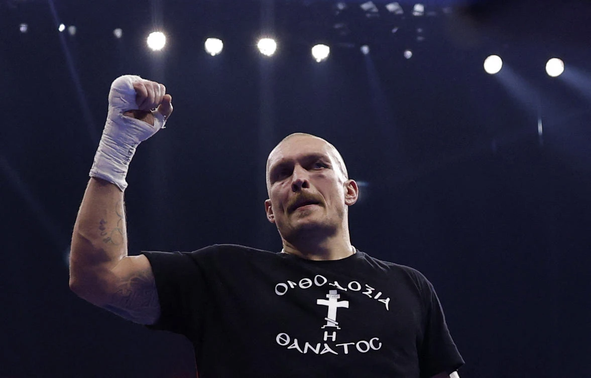 Oleksandr Usyk celebrates his win. (Action Images/Reuters)