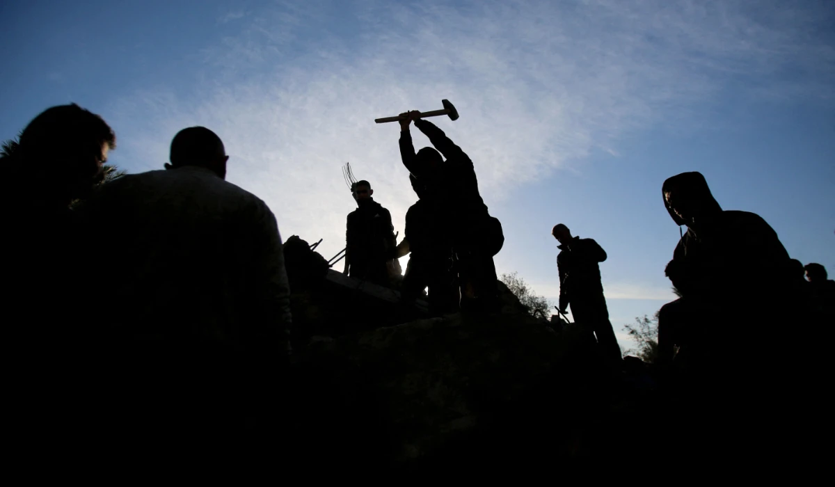 People search for survivors at the site of an Israeli strike that targeted the Abu Samra family home in Deir el-Balah in the central Gaza Strip on December 22, 2024, amid the ongoing war between Israel and the Palestinian militant group Hamas. (AFP)