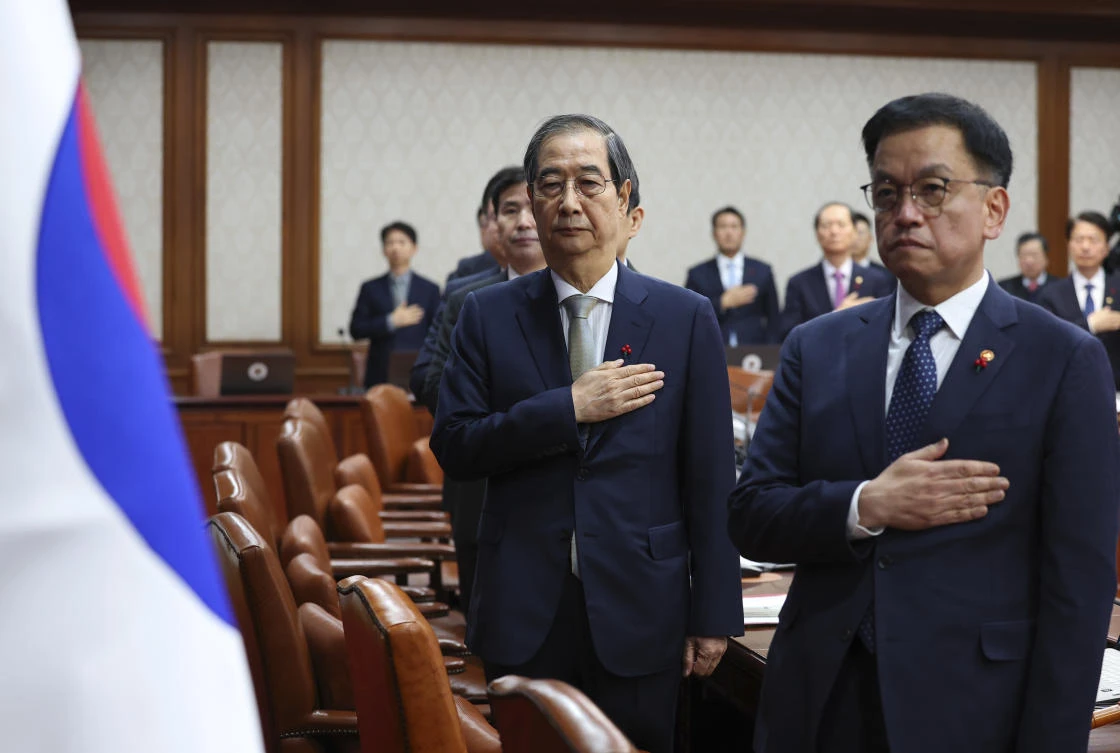 South Korea’s Prime Minister Han Duck-soo, second from right, who became the country’s acting leader after President Yoon Suk Yeol’s impeachment, salutes during a cabinet meeting at the government complex in Seoul, South Korea, Tuesday, Dec. 24, 2024. (AP)