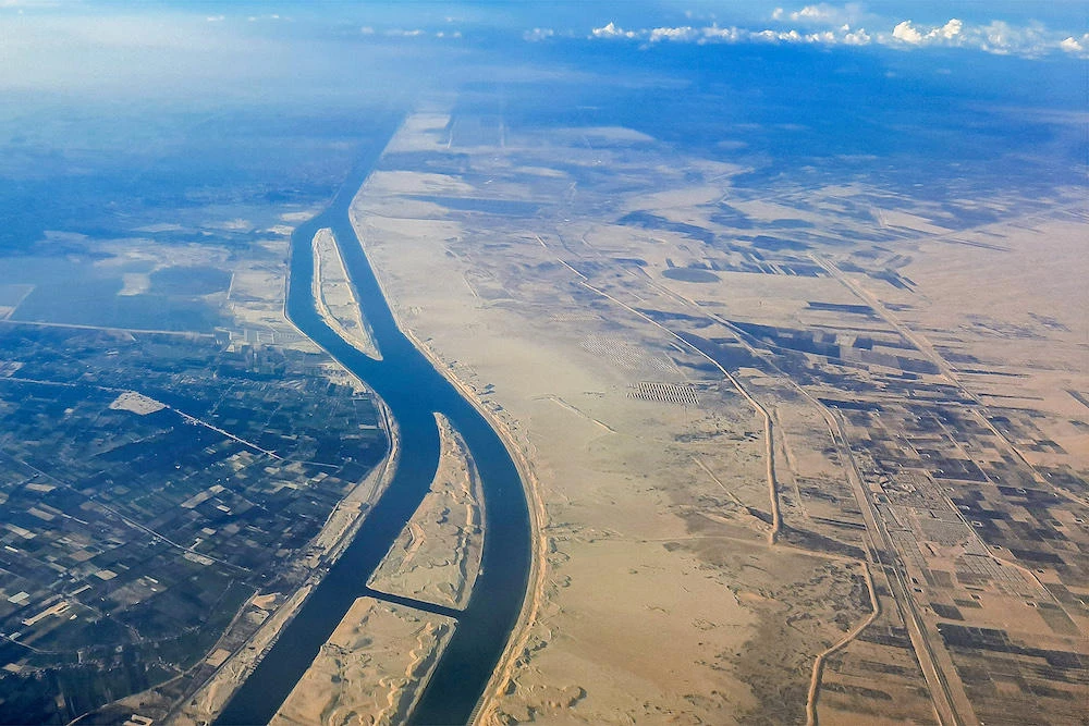 Above, an aerial view of the new extension to the Suez Canal Al-Ferdan, north of Ismailia in northeastern Egypt. (AFP file photo)