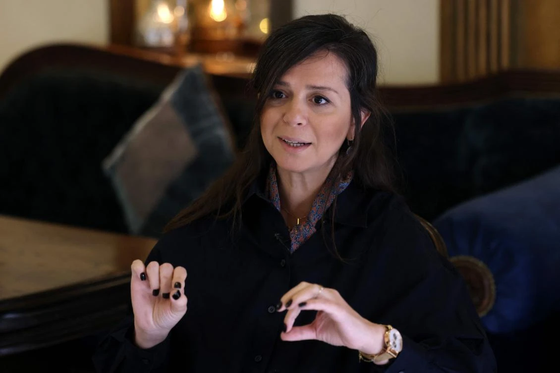Rasha Muhrez, Syria Response Director at the Save The Children Fund, gives an interview in Damascus on December 30, 2024, talking about half of school-age children in Syria who are missing out on their education. (AFP)