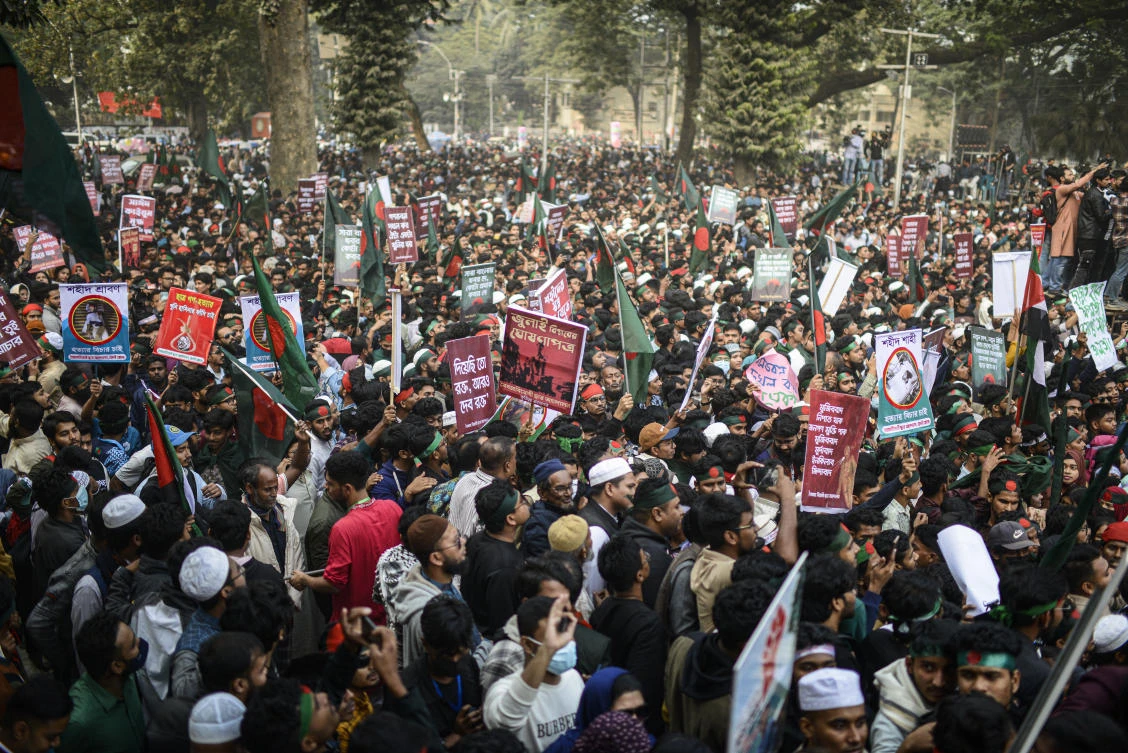 Students carry placards and shout slogans during “March for Unity” organized by The Anti-Discrimination Student Movement at the Central Shaheed Minar, a national monument, in Dhaka, Bangladesh, Tuesday, Dec. 31, 2024. (AP)