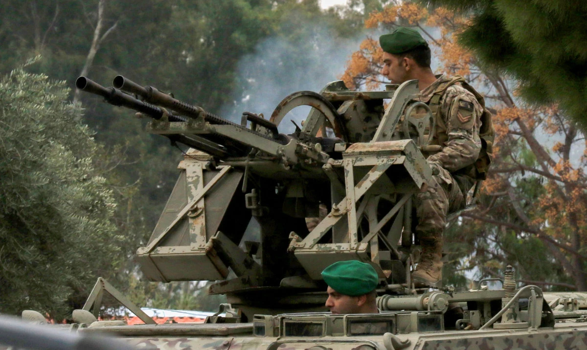 Lebanese soldiers man an armoured vehicle in the southern Lebanese town of Tyre on December 7, 2024. (AFP)