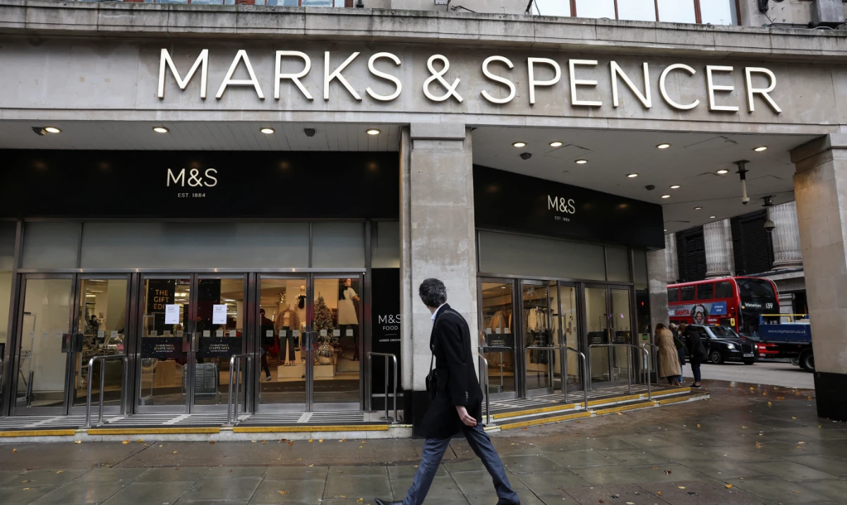 A passerby walks past a Marks & Spencer store near Marble Arch on Oxford Street, in London, Britain, December 5, 2024. (Reuters)