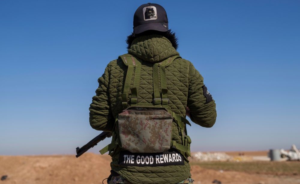 A Syrian Democratic Forces fighter secures a road in Daoudiya, Hassakeh province, Syria, Wednesday, Jan. 29, 2025. (AP Photo)