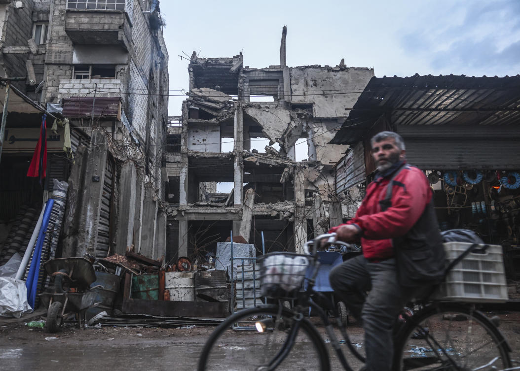AFP photographer Sameer Al-Doumy never dreamed he would be able to return to the hometown in Syria that he escaped through a tunnel seven years ago after it was besieged by Bashar Assad’s forces. (AP)