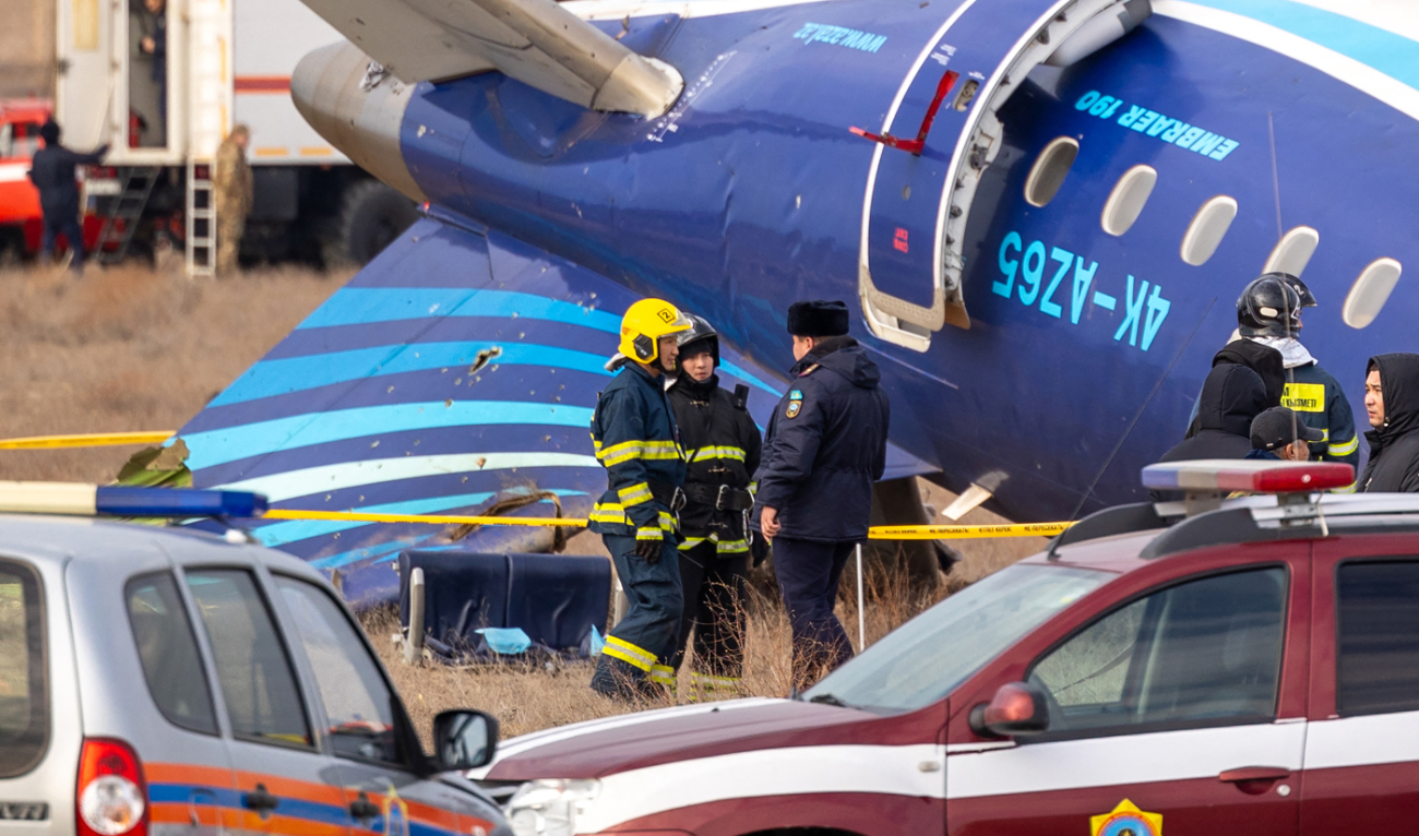 Emergency specialists work at the crash site of an Azerbaijan Airlines passenger jet near the western Kazakh city of Aktau on December 25, 2024. (AFP)