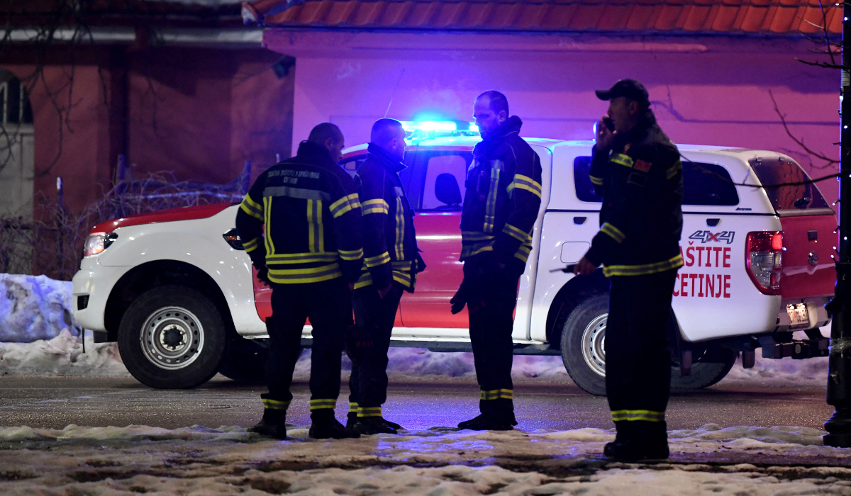 Police officers and civil protection units secure a crime scene after a gunman killed several people in the village of Bajice near Cetinje, on January 1, 2025. (AFP)