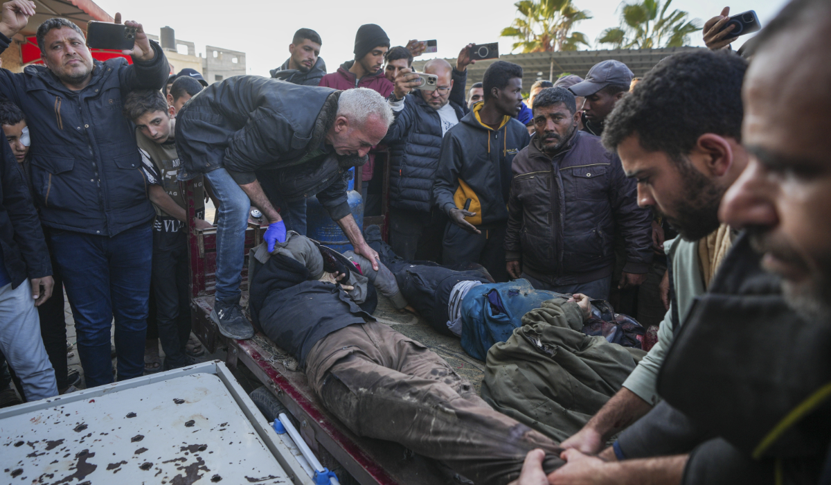 The bodies of men killed in an Israeli army strike targeting a car are brought to Al-Aqsa Martyrs hospital in Deir al-Balah, central Gaza Strip, Friday, Jan. 3, 2025. (AP)
